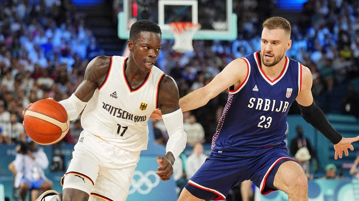 Germany point guard Dennis Schroder (17) dribbles the ball against Serbia shooting guard Marko Guduric (23) in the men's basketball bronze medal game during the Paris 2024 Olympic Summer Games at Accor Arena.