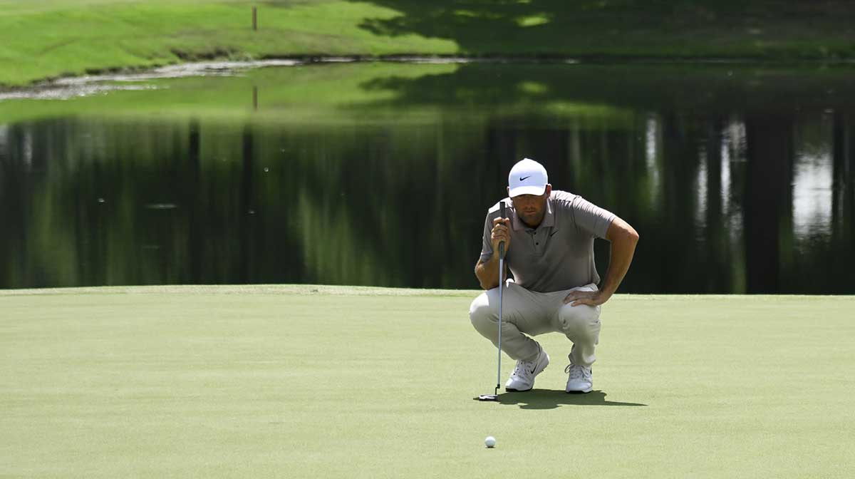 Scottie Scheffler looks at a putt during the final round of the FedEx St. Jude Championship golf.