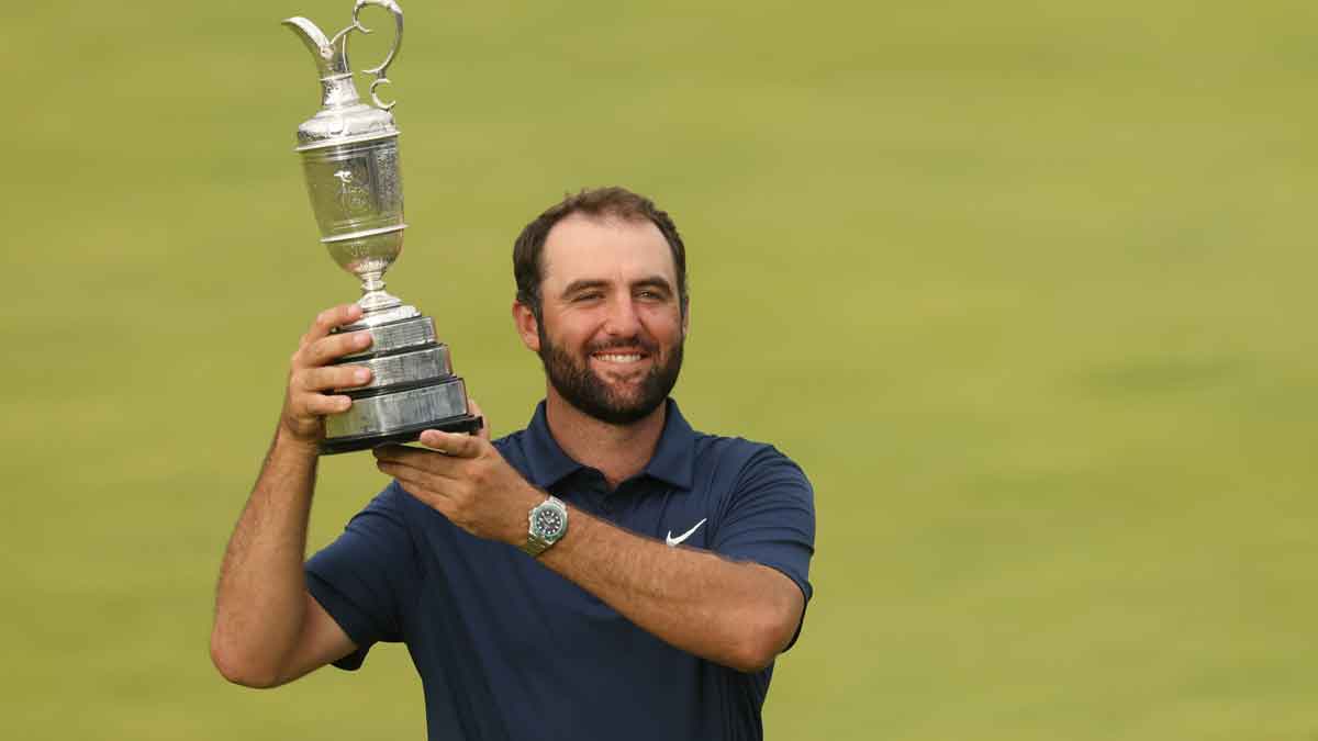 Scottie Scheffler celebrates with the Claret Jug after winning the 153rd Open Championship golf tournament at Royal Portrush.