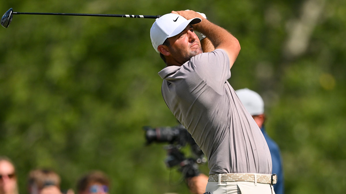 Scottie Scheffler plays his shot from the 18th tee during the final round of the FedEx St. Jude Championship golf.