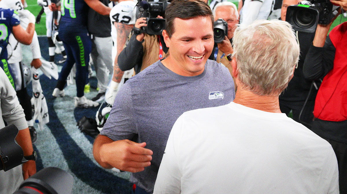Seahawks head coach Mike Macdonald and Las Vegas Raiders head coach Pete Carroll after the game at Lumen Field