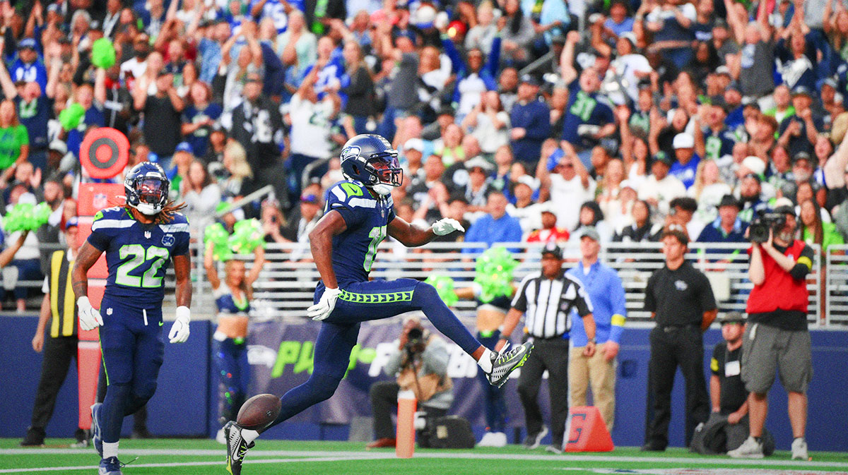 Seahawks wide receiver Tory Horton (15) scores a touchdown against the Las Vegas Raiders during the first half at Lumen Field
