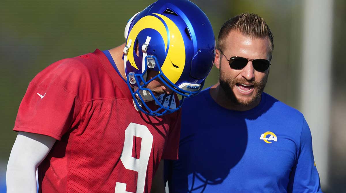 Los Angeles Rams coach Sean McVay (right) talks with quarterback Matthew Stafford (9) during training camp at UC Irvine.