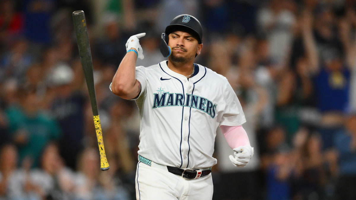 Seattle Mariners first baseman Josh Naylor (12) flips his bat after hitting a 2-run home run against the Chicago White Sox during the seventh inning at T-Mobile Park.