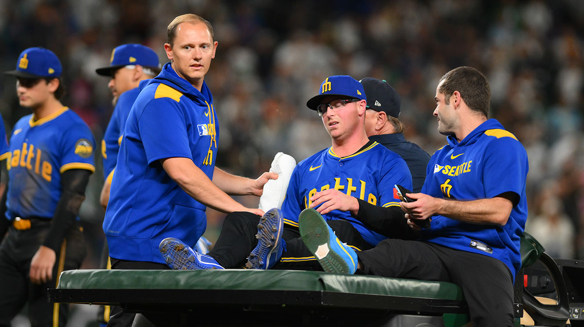 Seattle Mariners relief pitcher Trent Thornton (46) is carted off after an apparent leg injurt during the ninth inning against the Texas Rangers at T-Mobile Park.