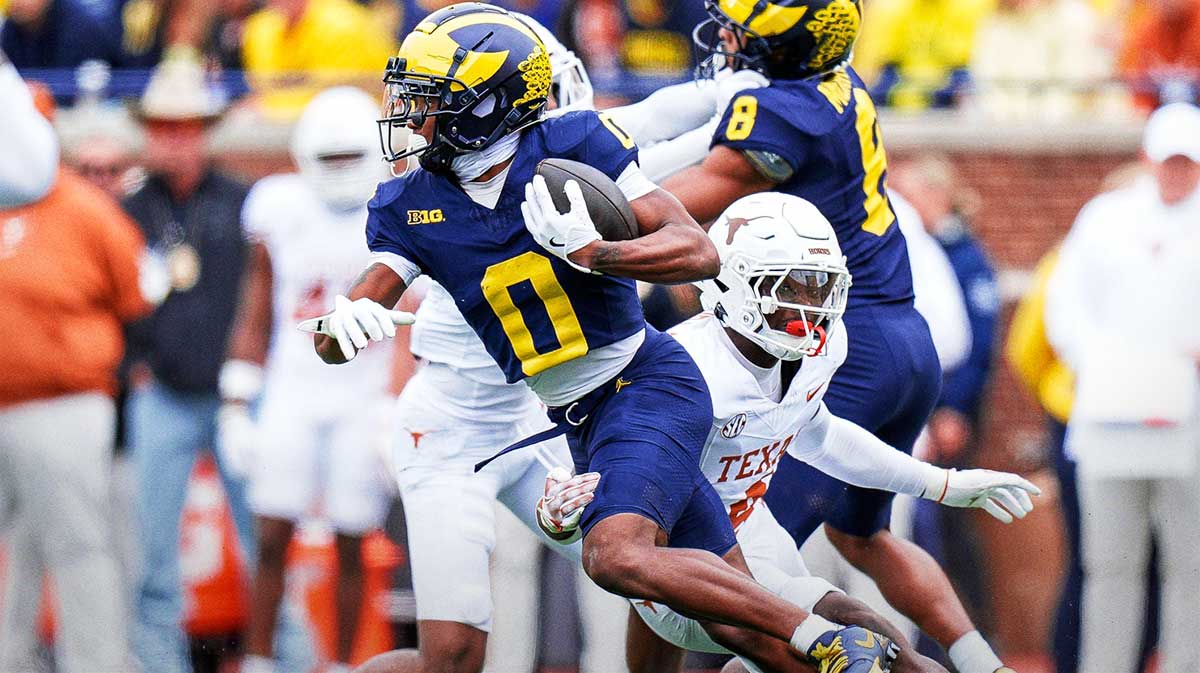 Michigan wide receiver Semaj Morgan (0) makes a catch against Texas during the first half at Michigan Stadium.