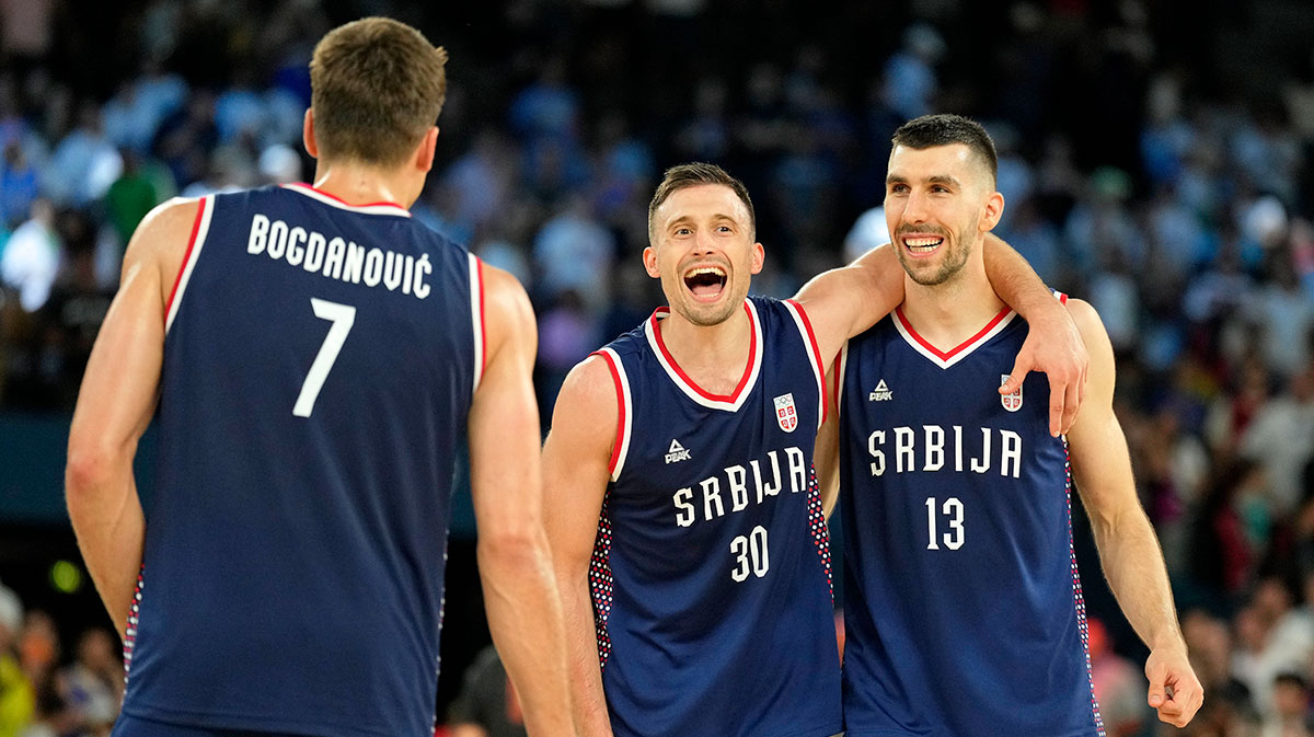 Serbia point guard Aleksa Avramovic (30) and shooting guard Ognjen Dobric (13) celebrate their win against Germany in the men's basketball bronze medal game during the Paris 2024 Olympic Summer Games at Accor Arena.