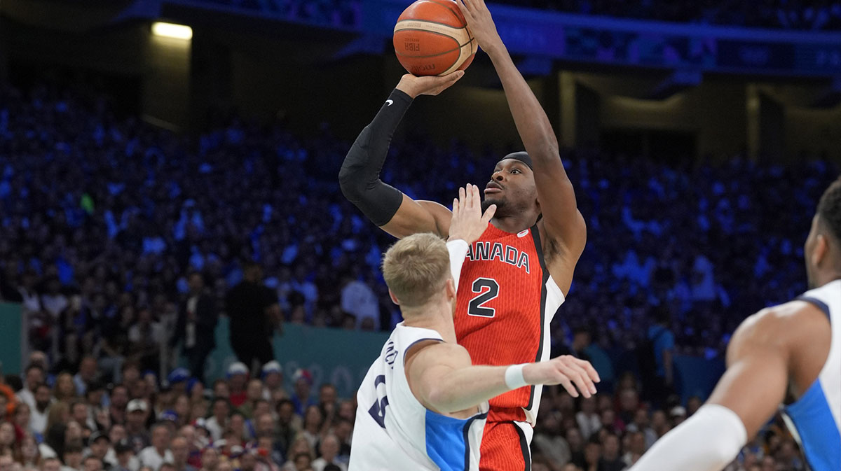 Canada guard Shai Gilgeous-Alexander (2) shoots against Greece point guard Thomas Walkup (0) in the first quarter during the Paris 2024 Olympic Summer Games at Stade Pierre-Mauroy.