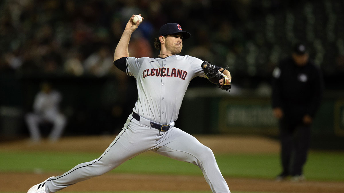 Cleveland Guardians starting pitcher Shane Bieber (57) delivers a pitch against the Oakland Athletics during the third inning at Oakland-Alameda County Coliseum.