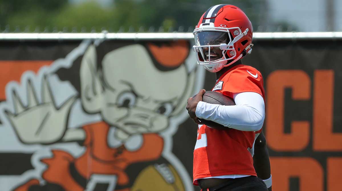 Browns quarterback Shedeur Sanders celebrates after breaking away for a big gain during practice, Wednesday, June 11, 2025, in Berea.