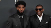 Deion Sanders (right) with his son Shedeur Sanders on the red carpet before Super Bowl LIX NFL Honors at Saenger Theatre.