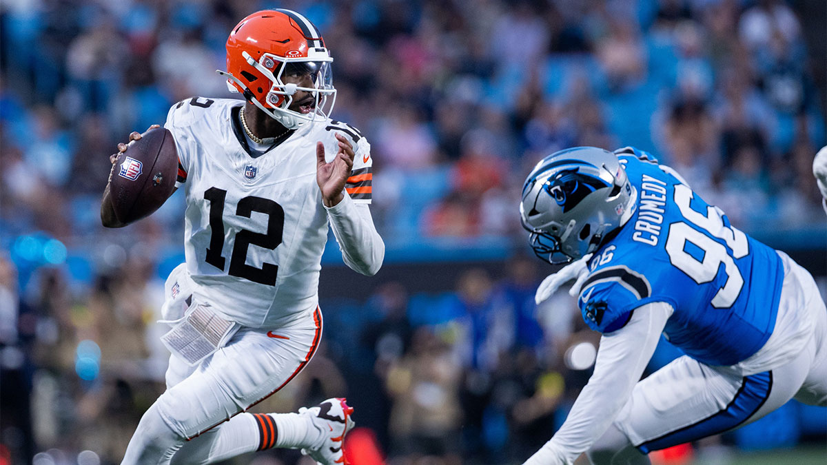 Cleveland Browns quarterback Shedeur Sanders (12) gets away from Carolina Panthers defensive tackle Jaden Crumedy (96) during the second quarter at Bank of America Stadium.