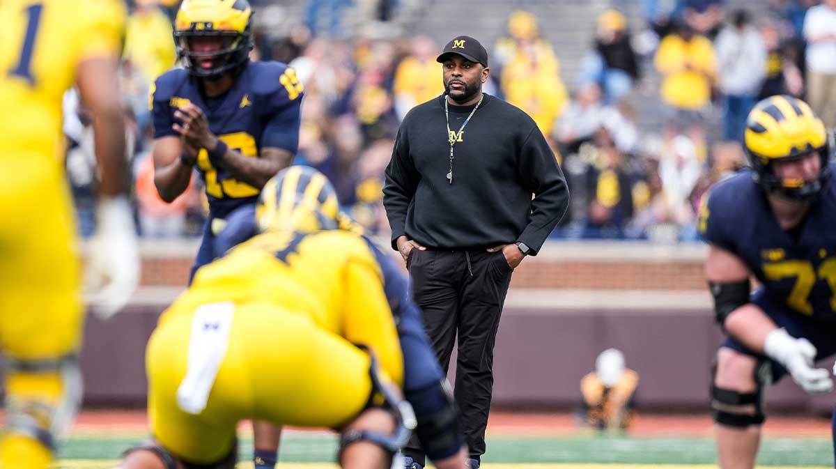 Michigan head coach Sherrone Moore watches a play behind quarterback Bryce Underwood (19) during the second half of the spring game at Michigan Stadium in Ann Arbor on Saturday, April 19, 2025.
