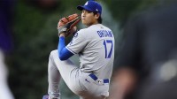 Los Angeles Dodgers two-way player Shohei Ohtani (17) prepares to delivers a pitch in the first inning against the Colorado Rockies at Coors Field.