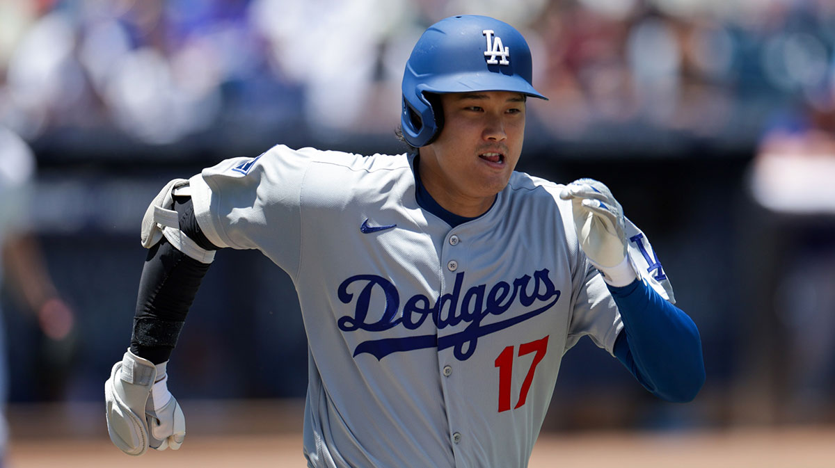 Los Angeles Dodgers designated hitter Shohei Ohtani (17) runs to first base against the Tampa Bay Rays in the seventh inning at George M. Steinbrenner Field.