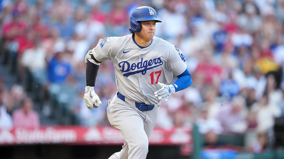 Los Angeles Dodgers designated hitter Shohei Ohtani (17) runs to first base in the first inning against the Los Angeles Angels at Angel Stadium.