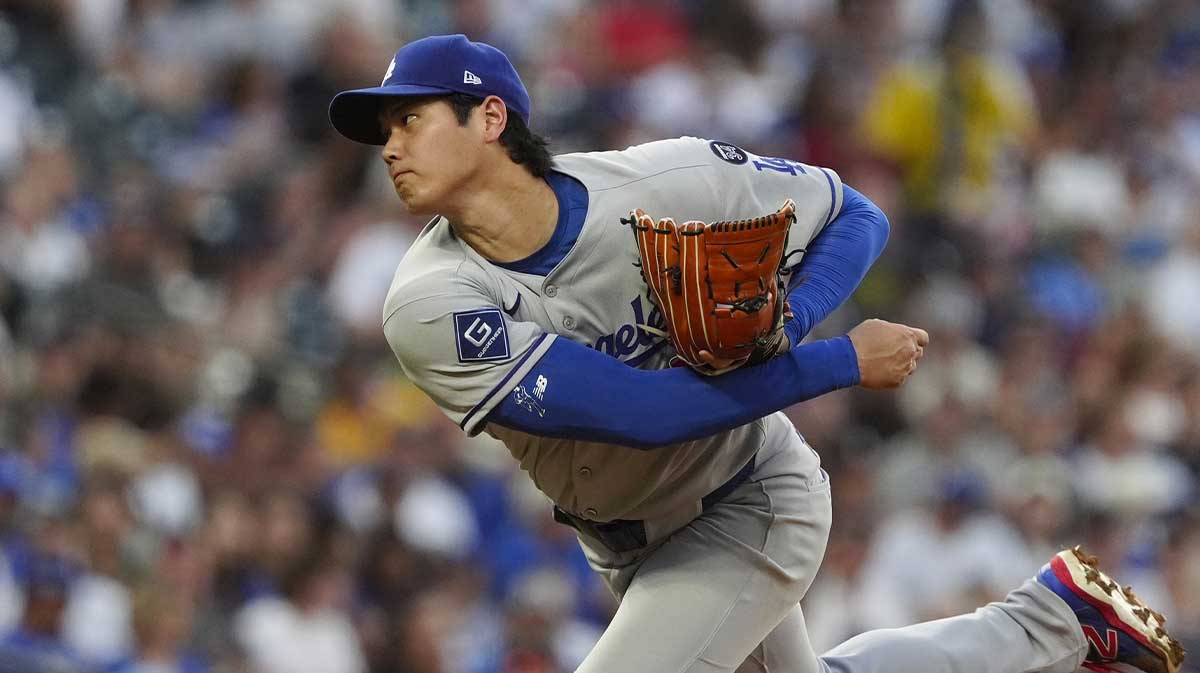 Los Angeles Dodgers two-way player Shohei Ohtani (17) delivers a pitch in third inning against the Colorado Rockies at Coors Field