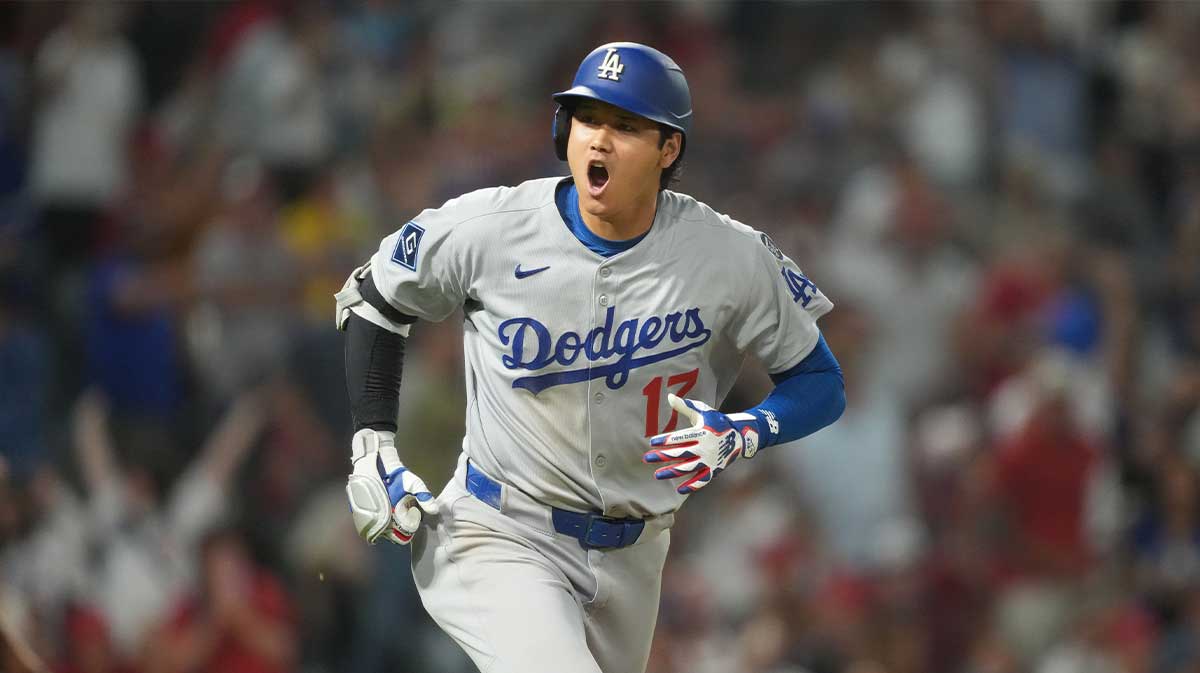 Los Angeles Dodgers designated hitter Shohei Ohtani (17) reacts after hitting a home run in the ninth inning against the Los Angeles Angels at Angel Stadium.