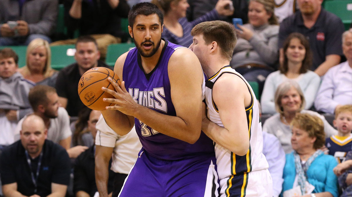 Sacramento Kings center Sim Bhullar (32) dribbles the ball as Utah Jazz forward Jack Cooley (45) defends during the fourth quarter at EnergySolutions Arena. Utah Jazz on the game 103-91.