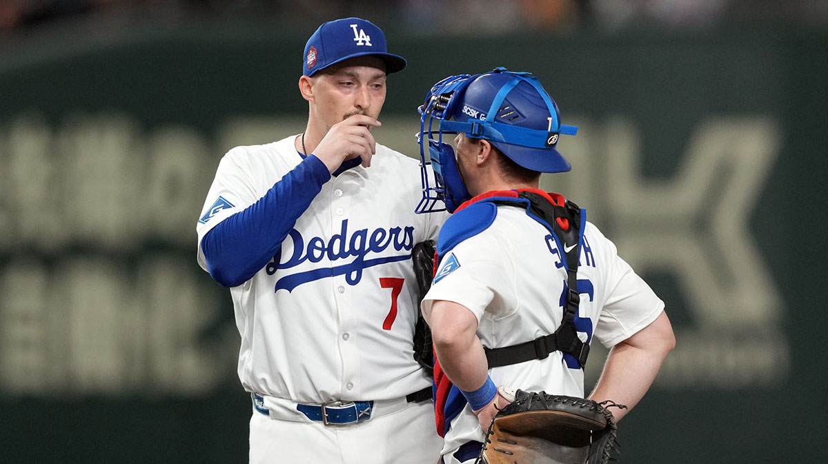 Mar 16, 2025; Bunkyo, Tokyo, Japan; Los Angeles Dodgers starting pitcher Blake Snell (7) talks with catcher Will Smith (right) during the fourth inning against the Hanshin Tigers at Tokyo Dome.