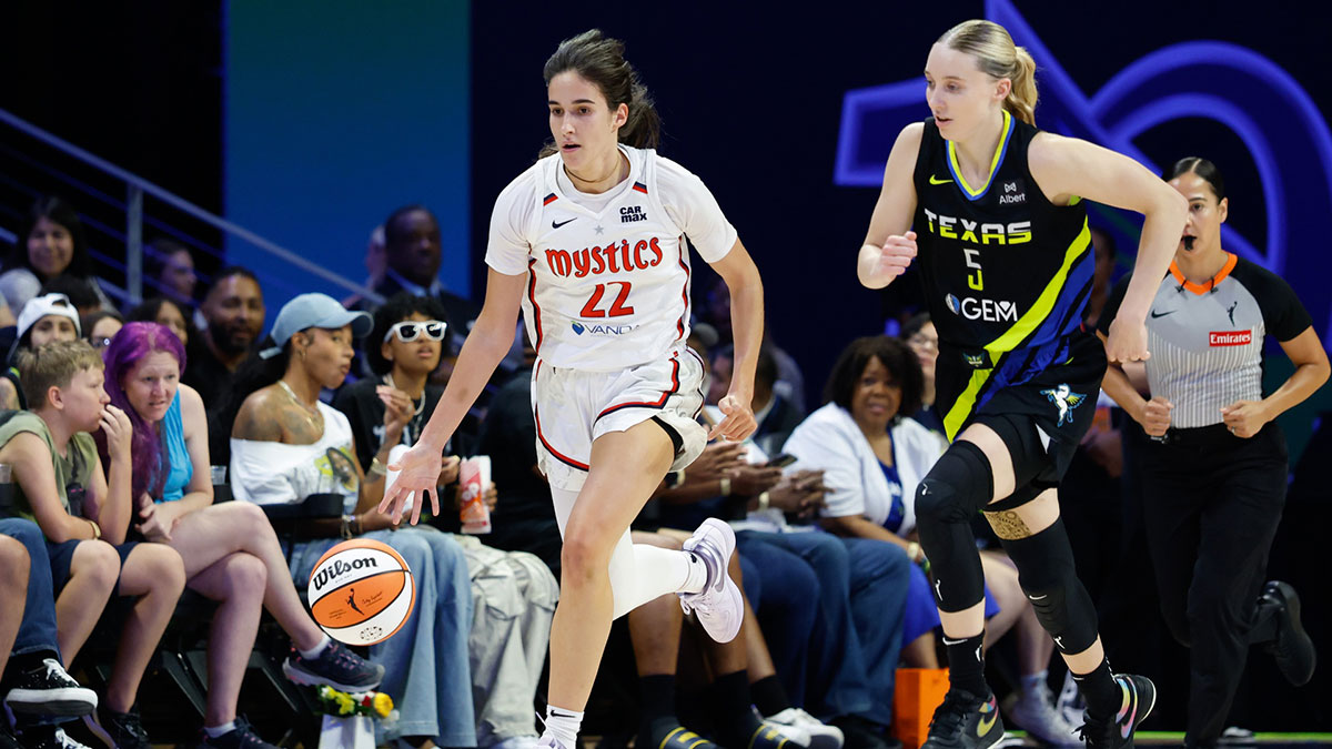 Washington Mystics guard Sonia Citron (22) dribbles upcourt ahead of Dallas Wings guard Paige Bueckers (5) during the first half at College Park Center.
