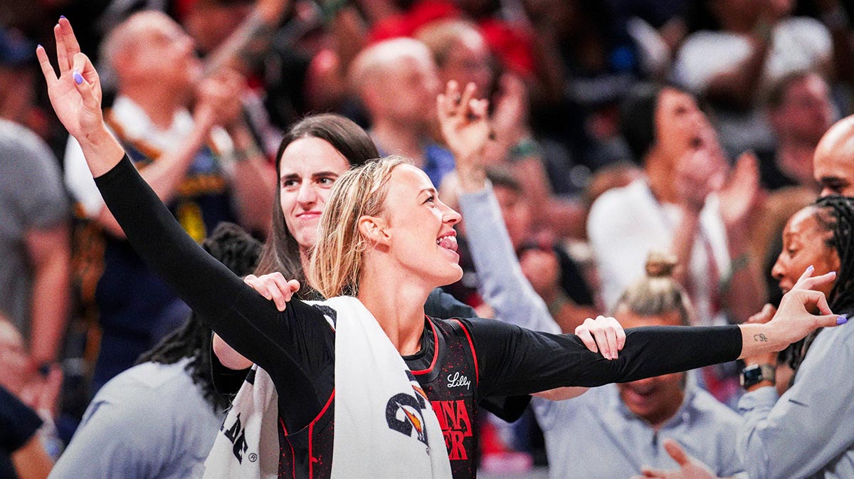 Indiana Fever guard Sophie Cunningham (8) and Indiana Fever guard Caitlin Clark (22) celebrate from the bench during a game between the Indiana Fever and the Chicago Sky.