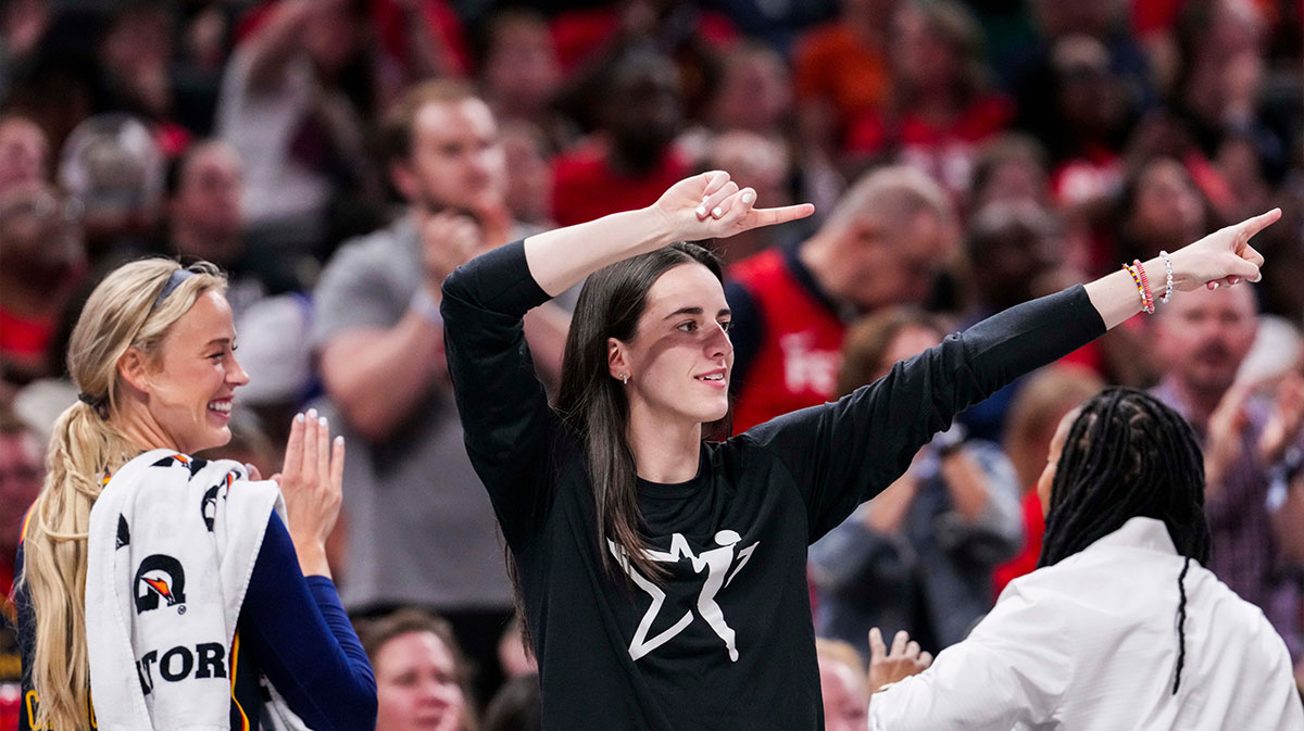 Indiana Fever guard Sophie Cunningham (8) and Indiana Fever guard Caitlin Clark (22) celebrate from the bench Thursday, July 3, 2025, during a game between the Indiana Fever and the Las Vegas Aces at Gainbridge Fieldhouse in Indianapolis.