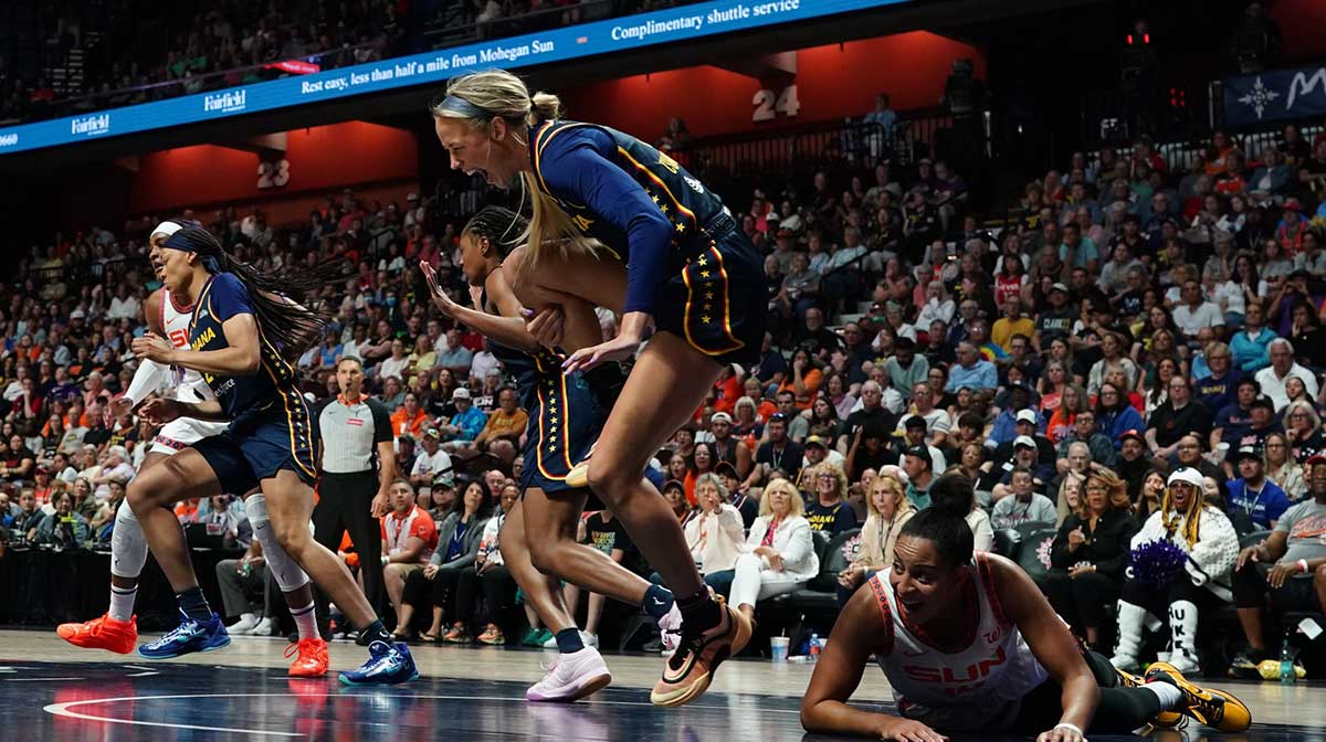 Indiana Fever guard Sophie Cunningham (8) is injured on a play against Connecticut Sun guard Bria Hartley (14) in the first half at Mohegan Sun Arena.