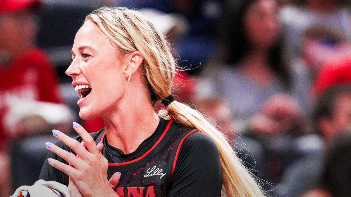 Indiana Fever guard Sophie Cunningham (8) celebrates from the bench Saturday, Aug. 9, 2025, during a game between the Indiana Fever and the Chicago Sky at Gainbridge Fieldhouse in Indianapolis.