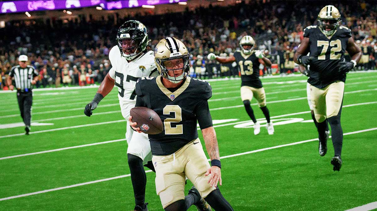 New Orleans Saints quarterback Spencer Rattler (2) scores a two point conversion to tie the game against the Jacksonville Jaguars in the fourth quarter at Caesars Superdome.