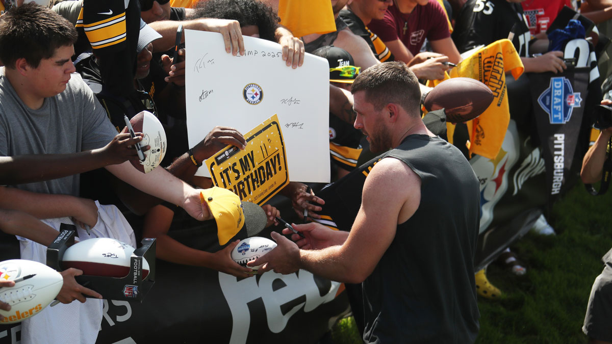 Pittsburgh Steelers linebacker T.J. Watt (90) signs autographs during training camp at Saint Vincent College.