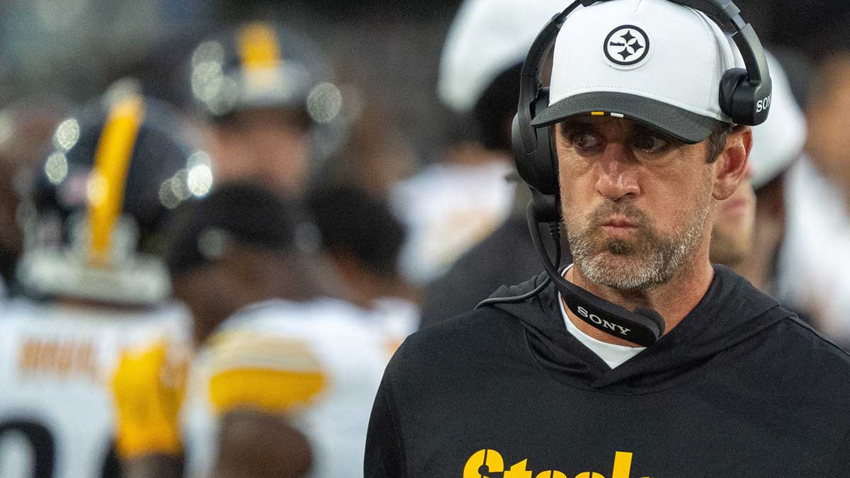 Steelers quarterback Aaron Rodgers (8) walks along the sideline with a head set during the first half of the first preseason game where the Jacksonville Jaguars hosted the Pittsburgh Steelers Saturday Aug. 9, 2025, at EverBank Stadium in Jacksonville, Fla.