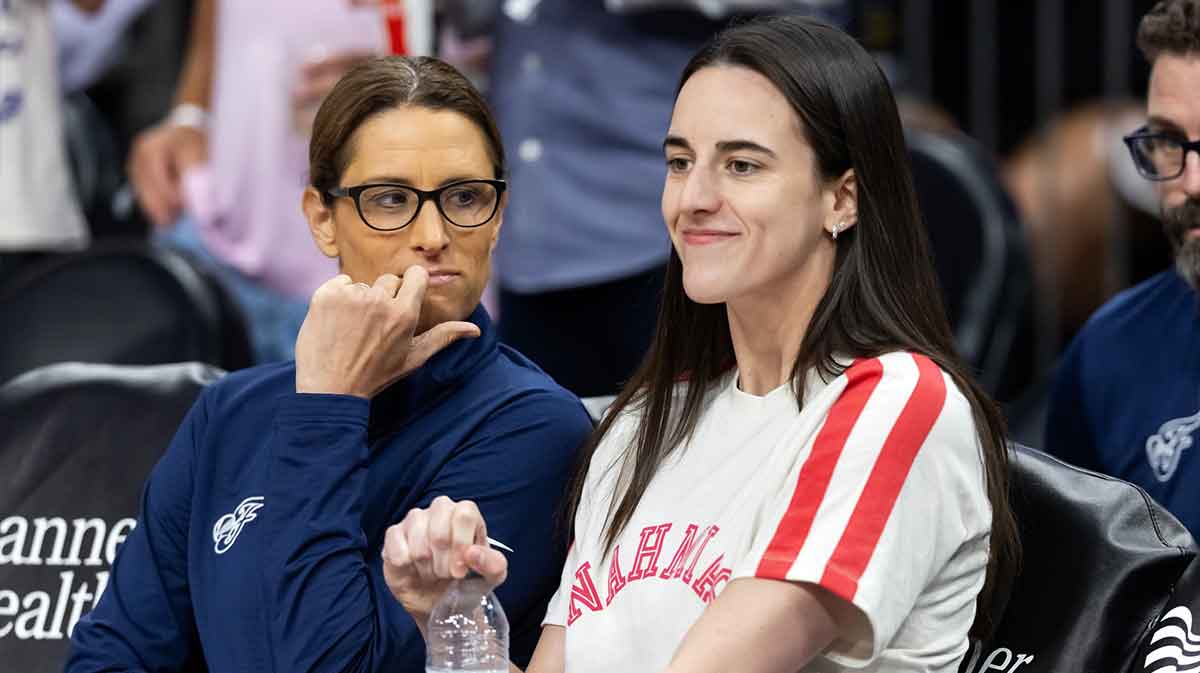 Indiana Fever injured guard Caitlin Clark (right) with head coach Stephanie White against the Phoenix Mercury during an WNBA game at PHX Arena.