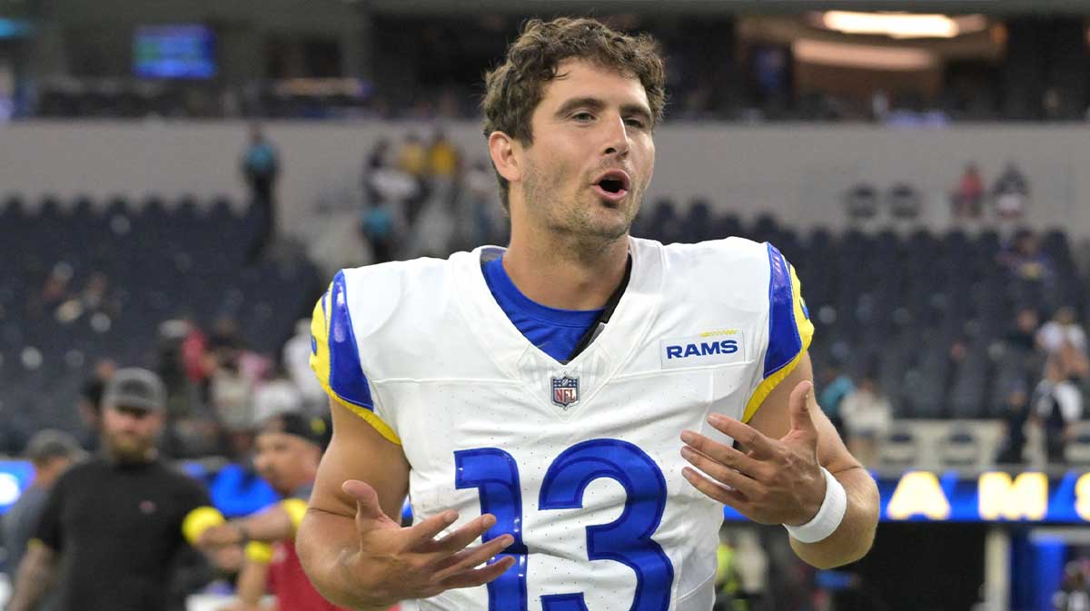 Los Angeles Rams quarterback Stetson Bennett IV (13) leaves the field after the game against the Dallas Cowboys at SoFi Stadium.