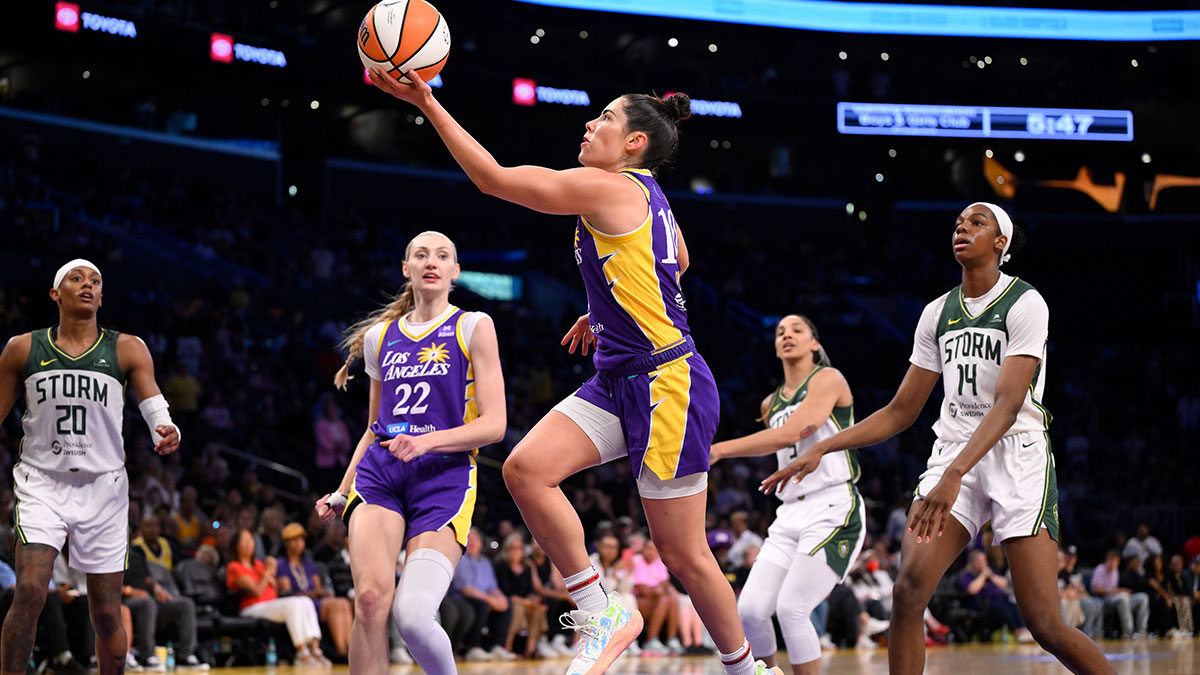 Los Angeles Sparks guard Kelsey Plum (10) drives to the basket past Seattle Storm center Dominique Malonga (14) during the second quarter at Crypto.com Arena.