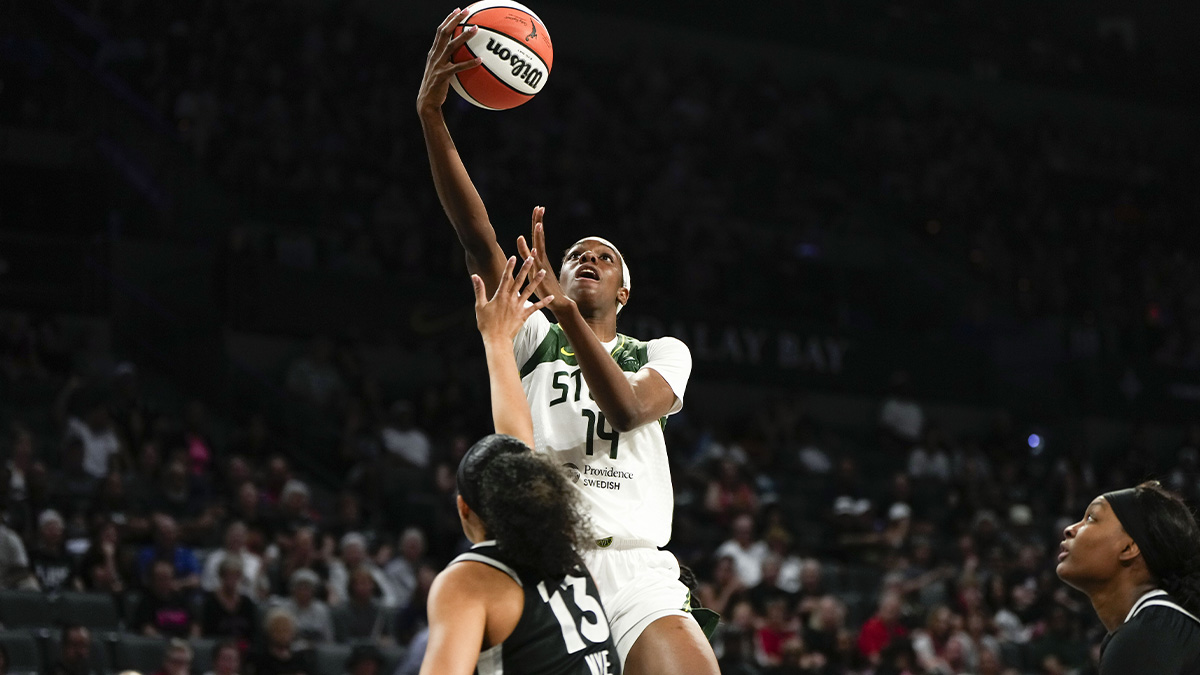 Seattle Storm center Dominique Malonga (14) attempts to score a layup against Las Vegas Aces guard Aaliyah Nye (13) during the second half of a WNBA basketball game at Michelob Ultra Arena.