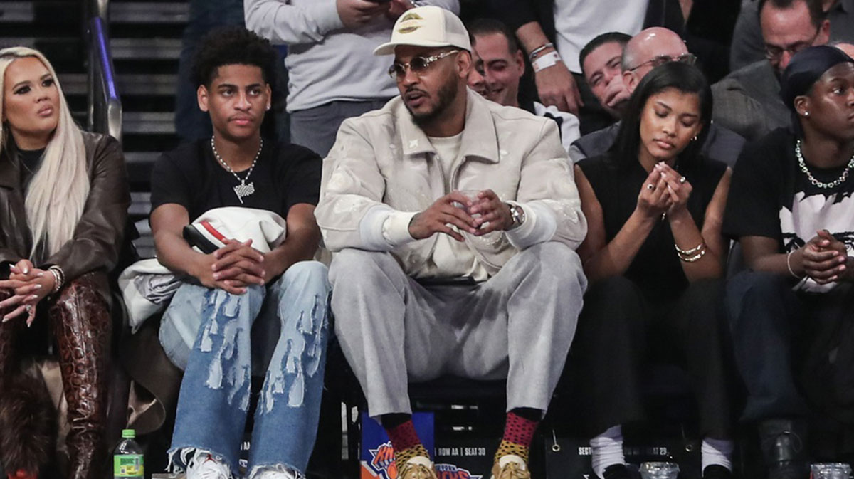 Former NBA player Carmelo Anthony (r) sits with his son Kiyan Anthony (l) at the game between the Boston Celtics and the New York Knicks at Madison Square Garden
