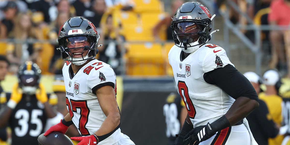 Tampa Bay Buccaneers cornerback Zyon McCollum (27) and linebacker Yaya Diaby (0) reacts after an interception by McCollum against the Pittsburgh Steelers during the first quarter at Acrisure Stadium.
