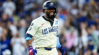 Los Angeles Dodgers right fielder Teoscar Hernandez (37) reacts after hitting a home run during the fifth inning against the San Diego Padres at Dodger Stadium.