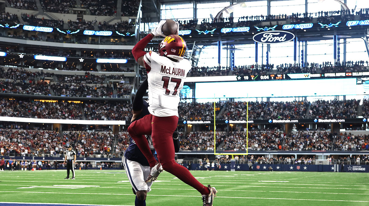Jan 5, 2025; Arlington, Texas, USA; Washington Commanders wide receiver Terry McLaurin (17) catches the game winning touchdown against Dallas Cowboys cornerback DaRon Bland (26) during the fourth quarter at AT&T Stadium.