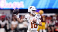 Texas Longhorns quarterback Arch Manning (16) warms up before the Peach Bowl at Mercedes-Benz Stadium.