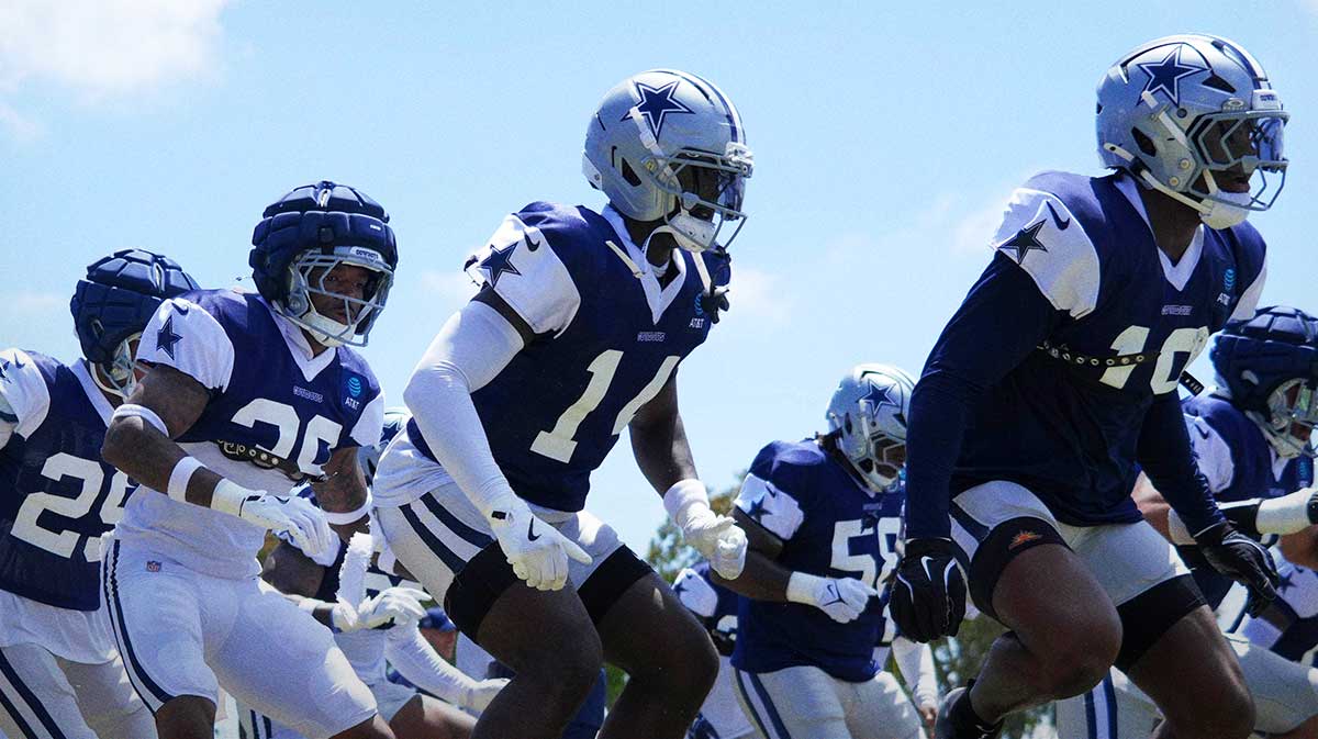 Dallas Cowboys defensive players run drills at training camp at the River Ridge Fields.