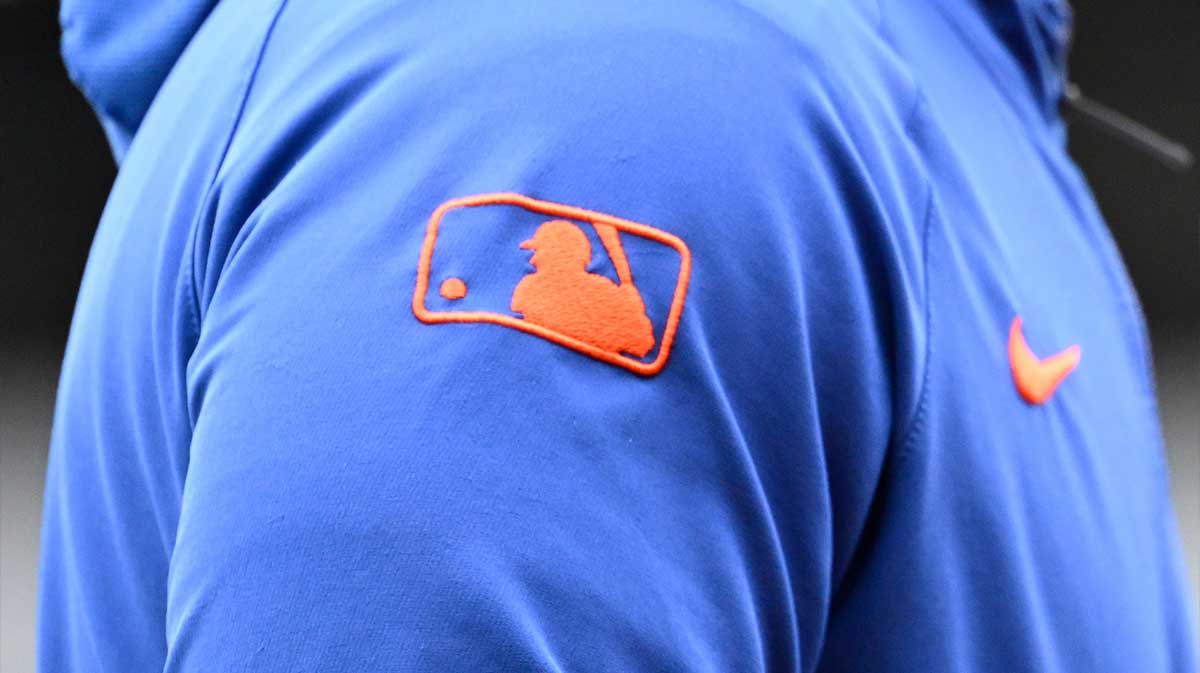 The MLB logo as seen on a New York Mets hoodie before a game against the Boston Red Sox at Fenway Park.
