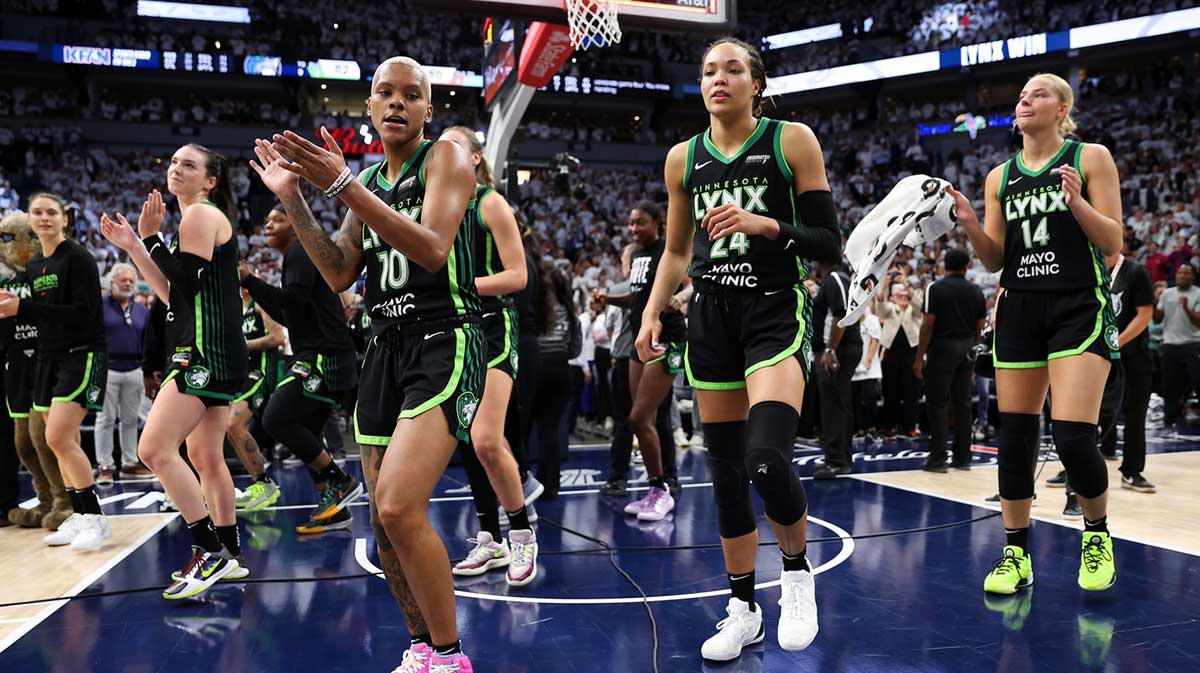 Minnesota Lynx players celebrate their teams win after game four of the 2024 WNBA Finals against the New York Liberty.