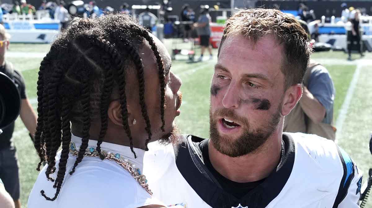 Minnesota Vikings wide receiver Justin Jefferson (18) and Carolina Panthers wide receiver Adam Thielen (19) after the game at Bank of America Stadium.