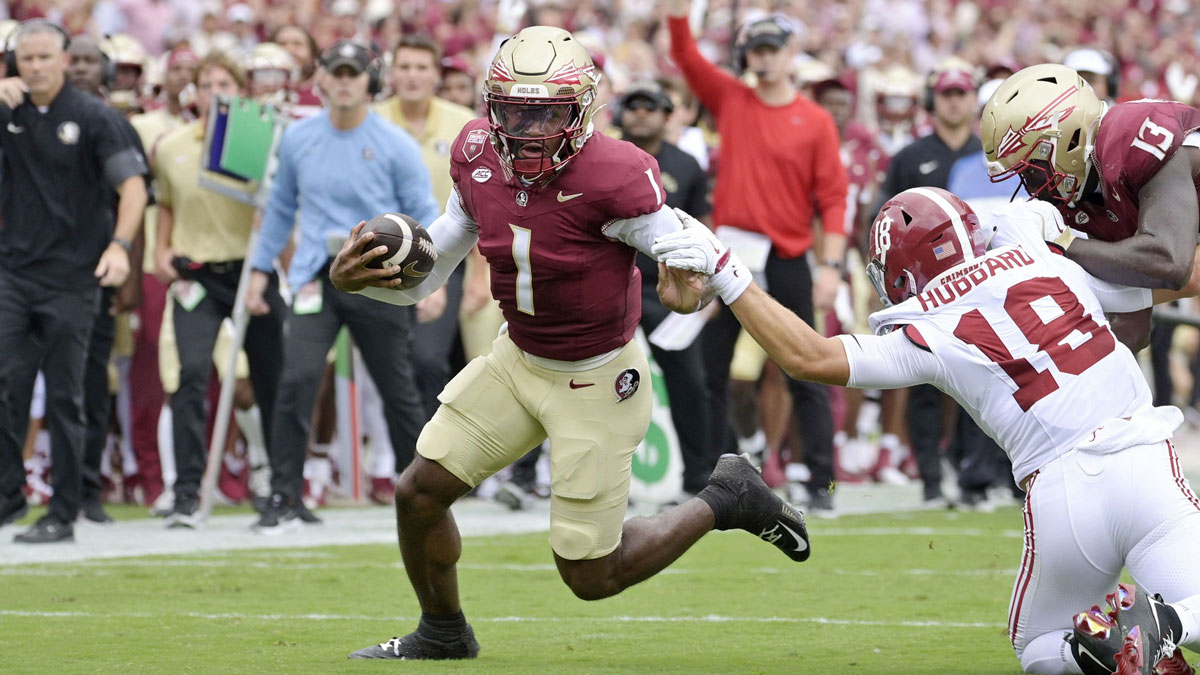 Florida State Seminoles quarterback Tommy Castellanos (1) runs for a touchdown against the Alabama Crimson Tide during the first half at Doak S. Campbell Stadium.