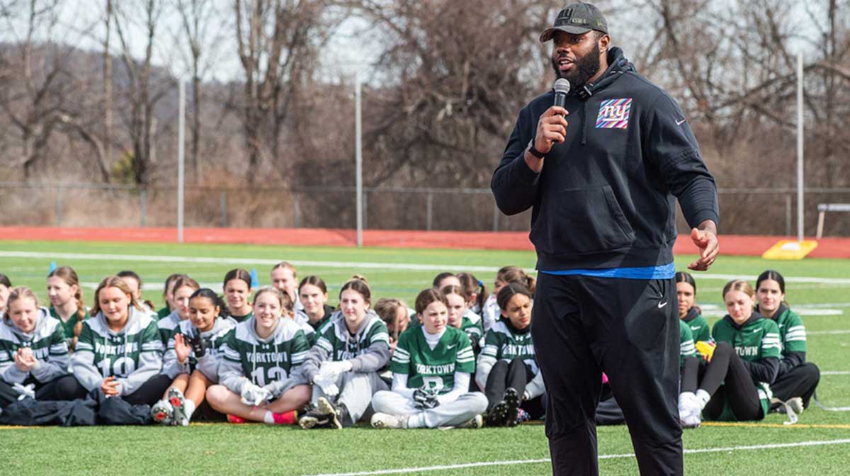 NY Giants tackle Andrew Thomas talks to players during the Section 1 flag football clinic at Somers High School in Lincolndale, NY on Saturday, March 22, 2025
