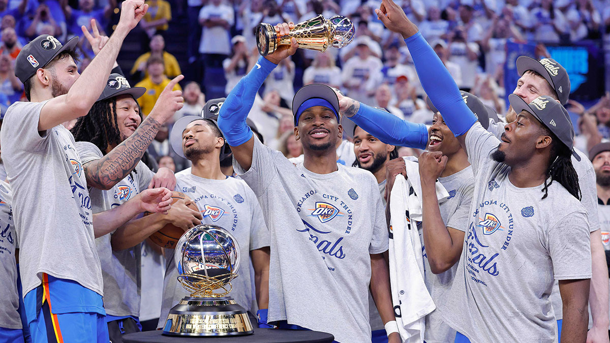 Thunder guard Shai Gilgeous-Alexander holds up the MVP trophy for the western conference finals for the 2025 NBA Playoffs at Paycom Center