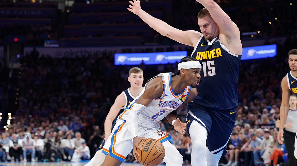 Thunder guard Shai Gilgeous-Alexander (2) drives against Denver Nuggets center Nikola Jokic (15) during the second half at Paycom Center