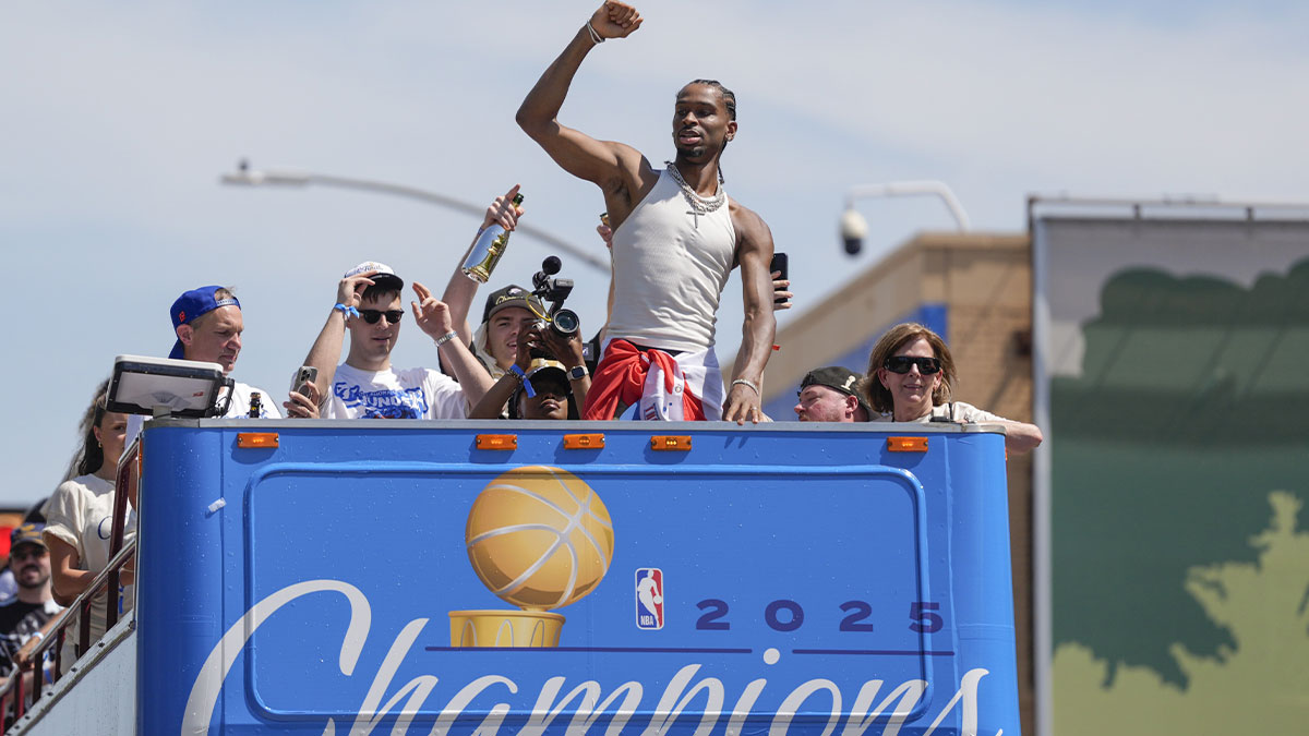 Thunder guard Shai Gilgeous-Alexander gestures to the crowd as the Oklahoma City Thunder celebrate their first NBA Finals title win with a champions parade throughout downtown Oklahoma City on Tuesday, June 24, 2025